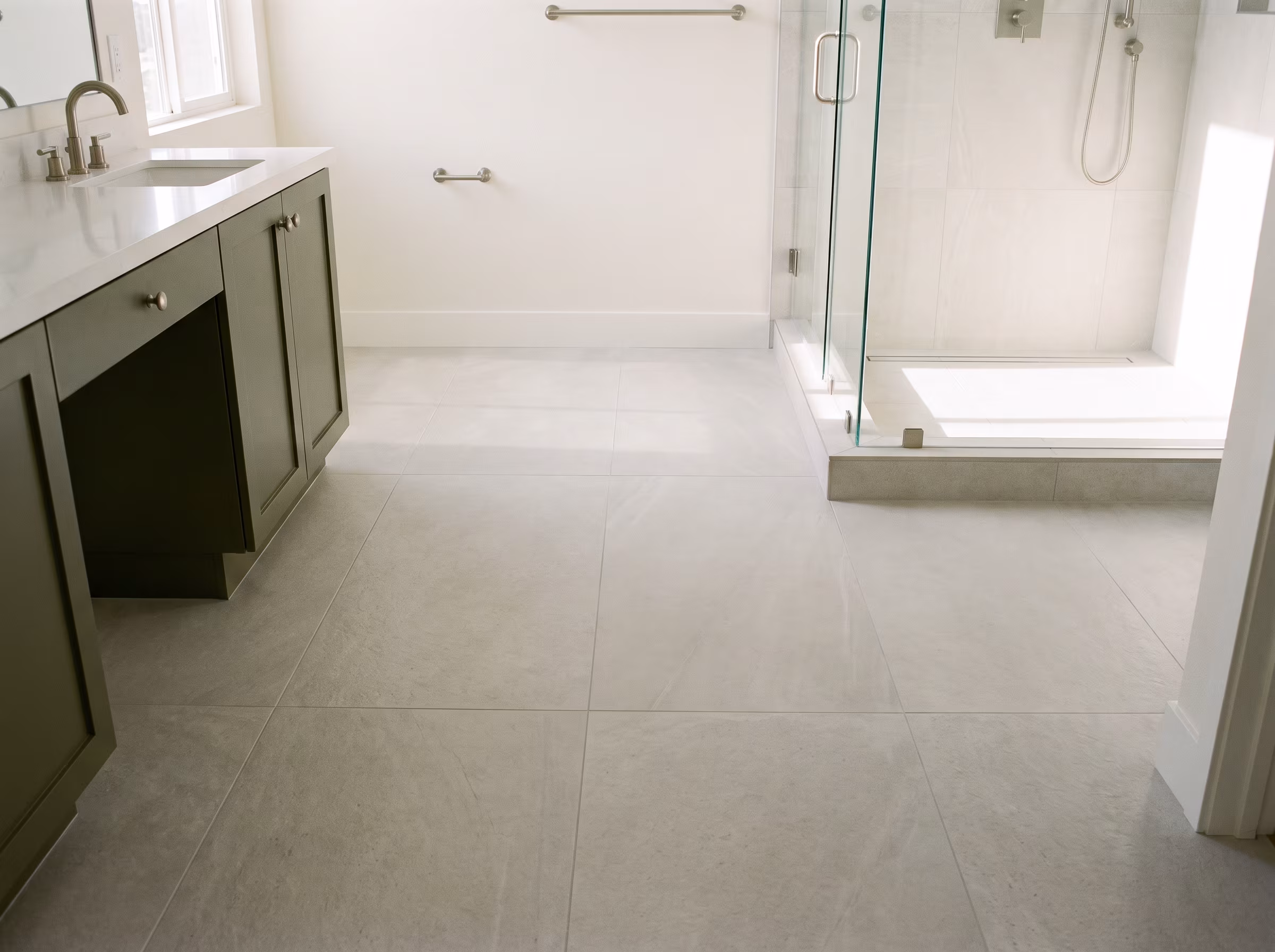 Finished bathroom floor after subfloor work and tile installation