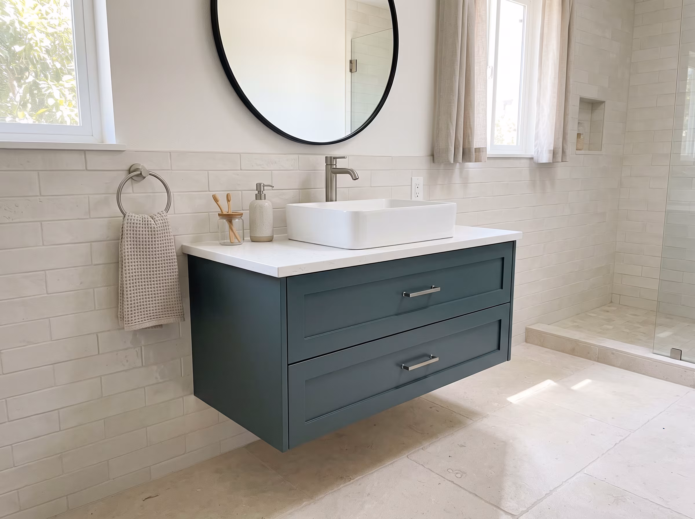 Wall-mounted floating vanity with vessel sink and round mirror
