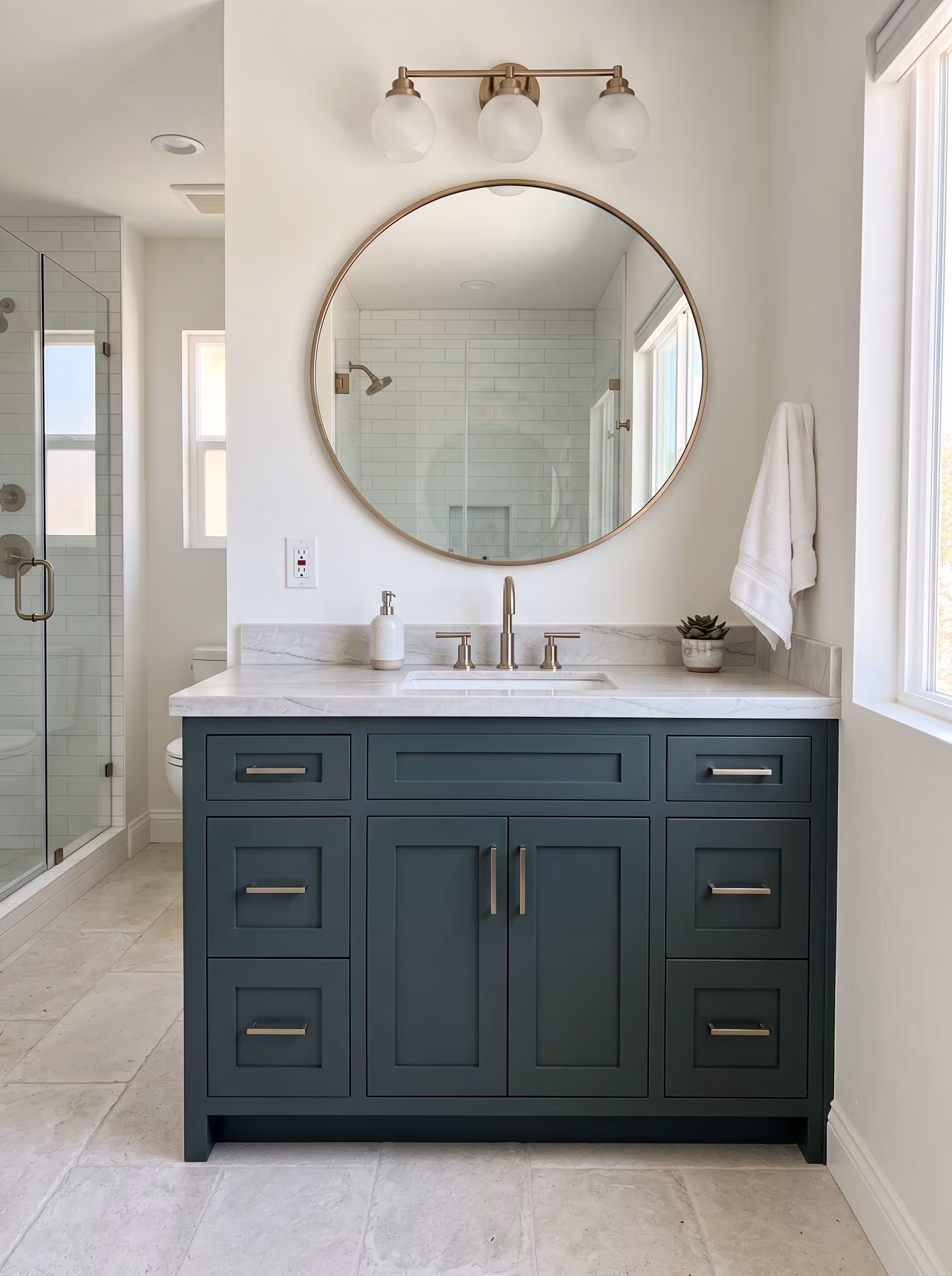 Finished bathroom vanity with oval mirror after installation
