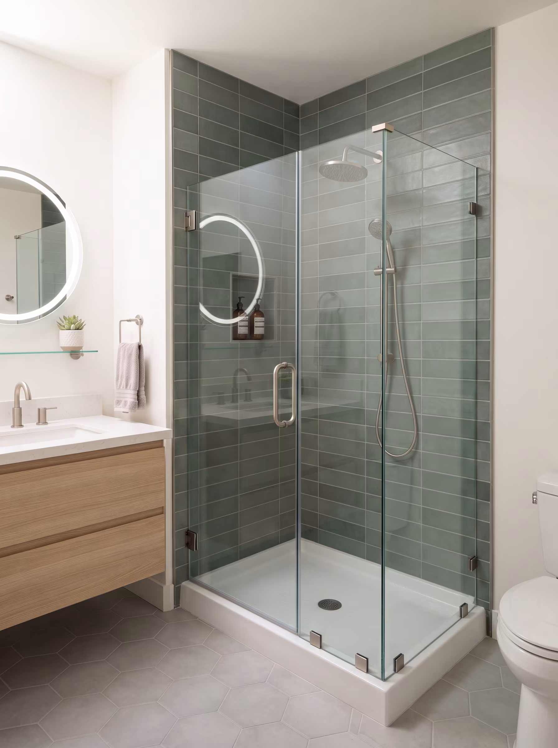 Alcove shower with a glass door in a residential bathroom