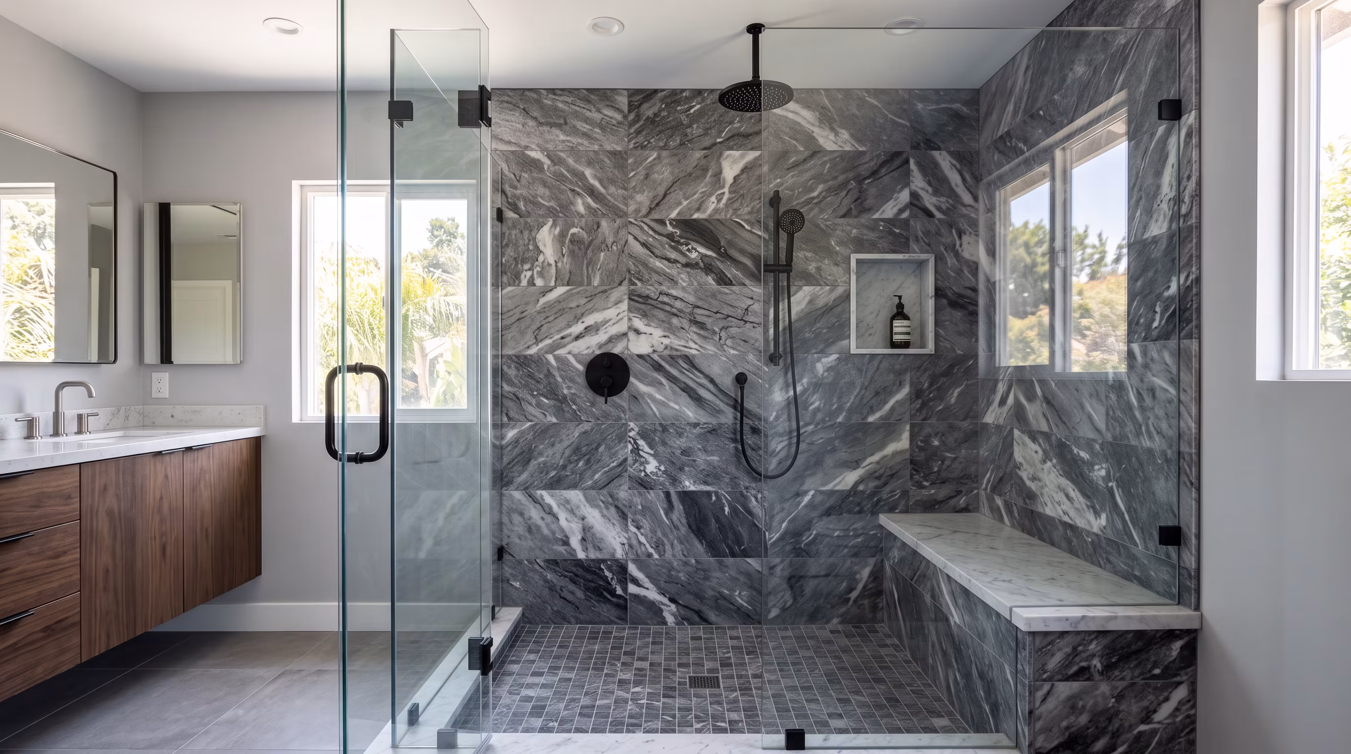 Spacious luxury bathroom featuring a contemporary marble shower with glass doors
