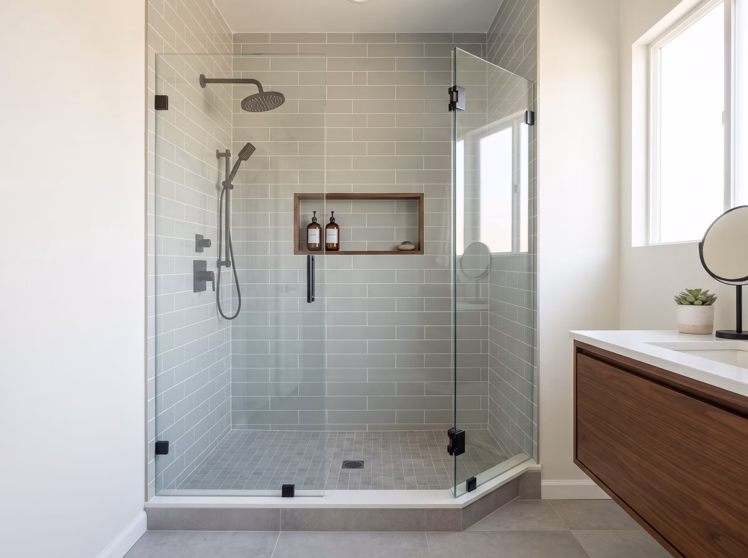 Finished alcove shower with glass door after a surface-level update