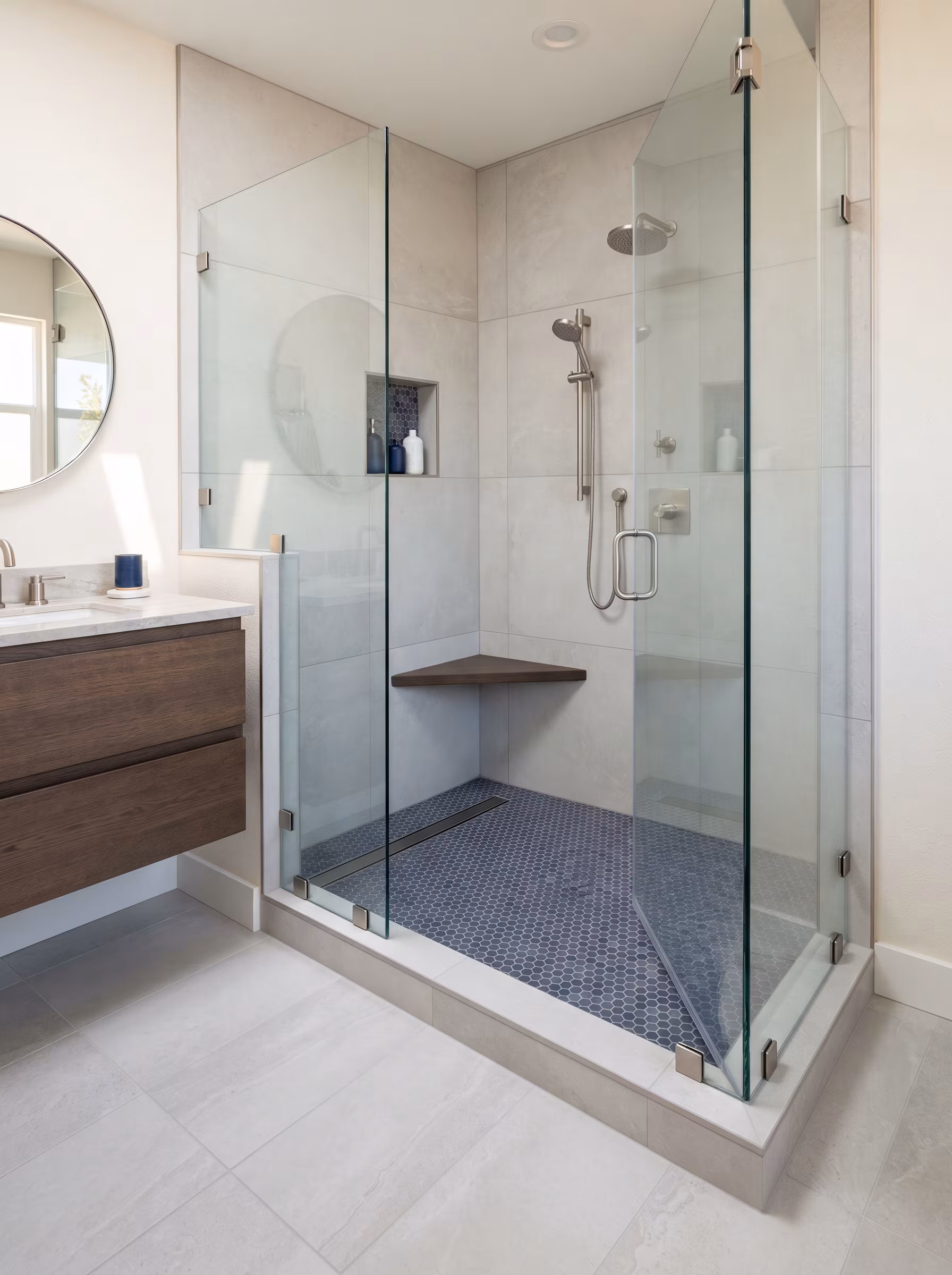 Open walk-in marble shower with frameless glass