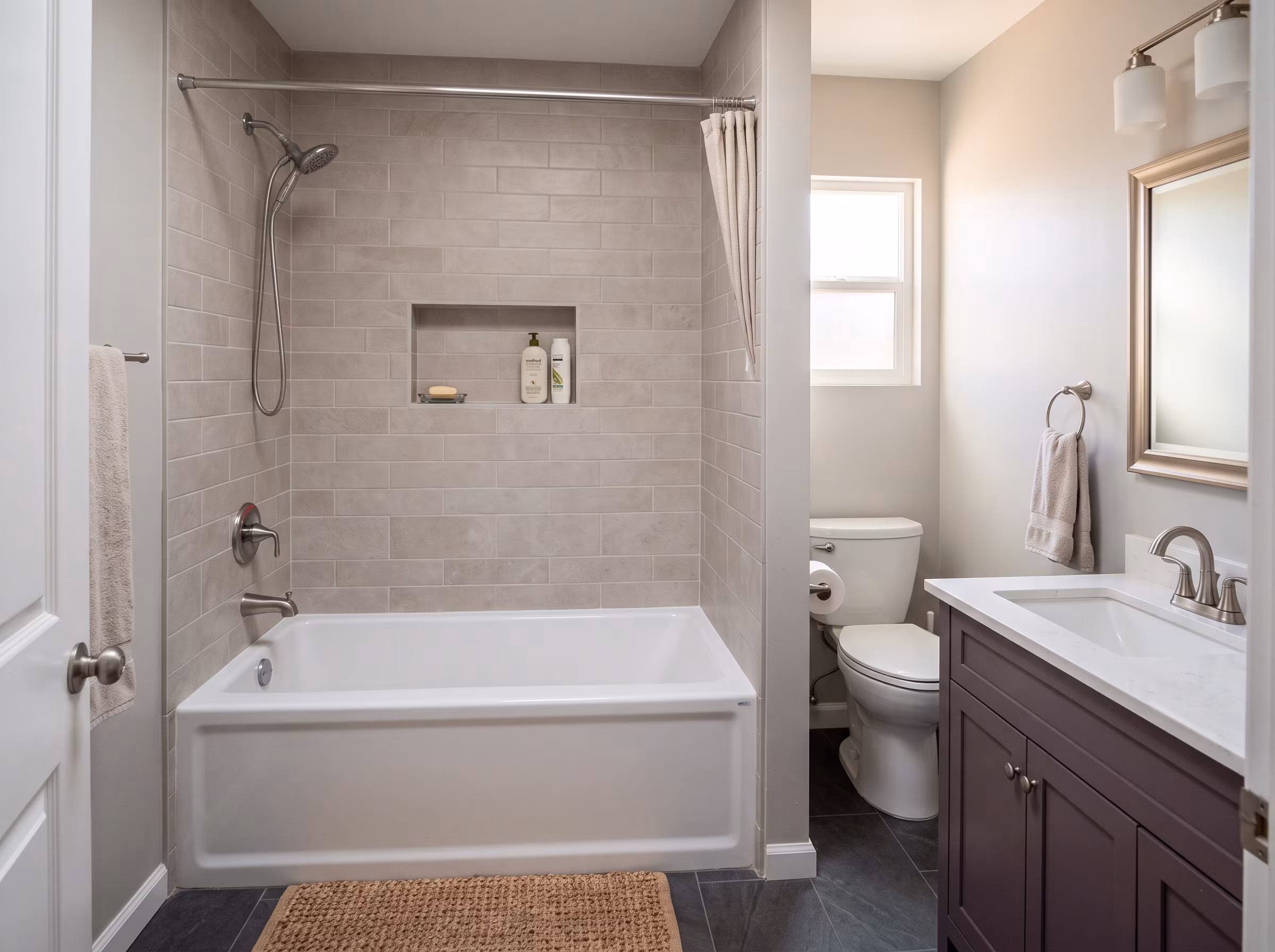 Compact bathroom corner with wall-mounted fixtures and limited floor space