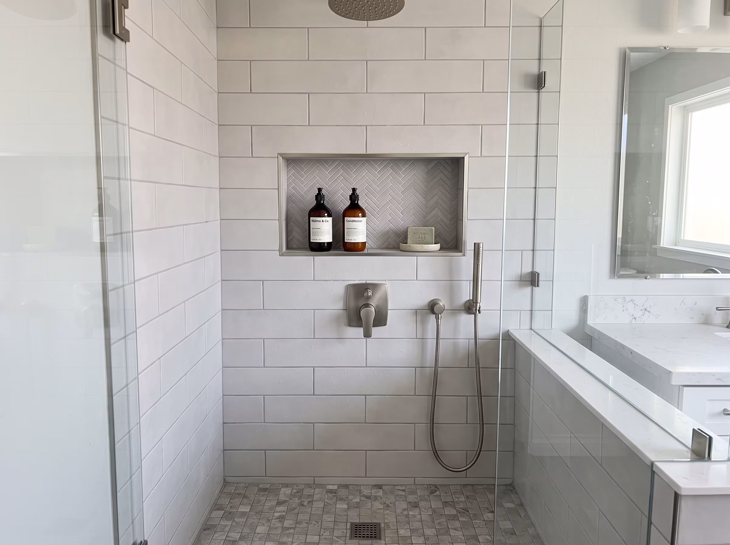 Wall-mounted floating vanity with vessel sink in a compact bathroom