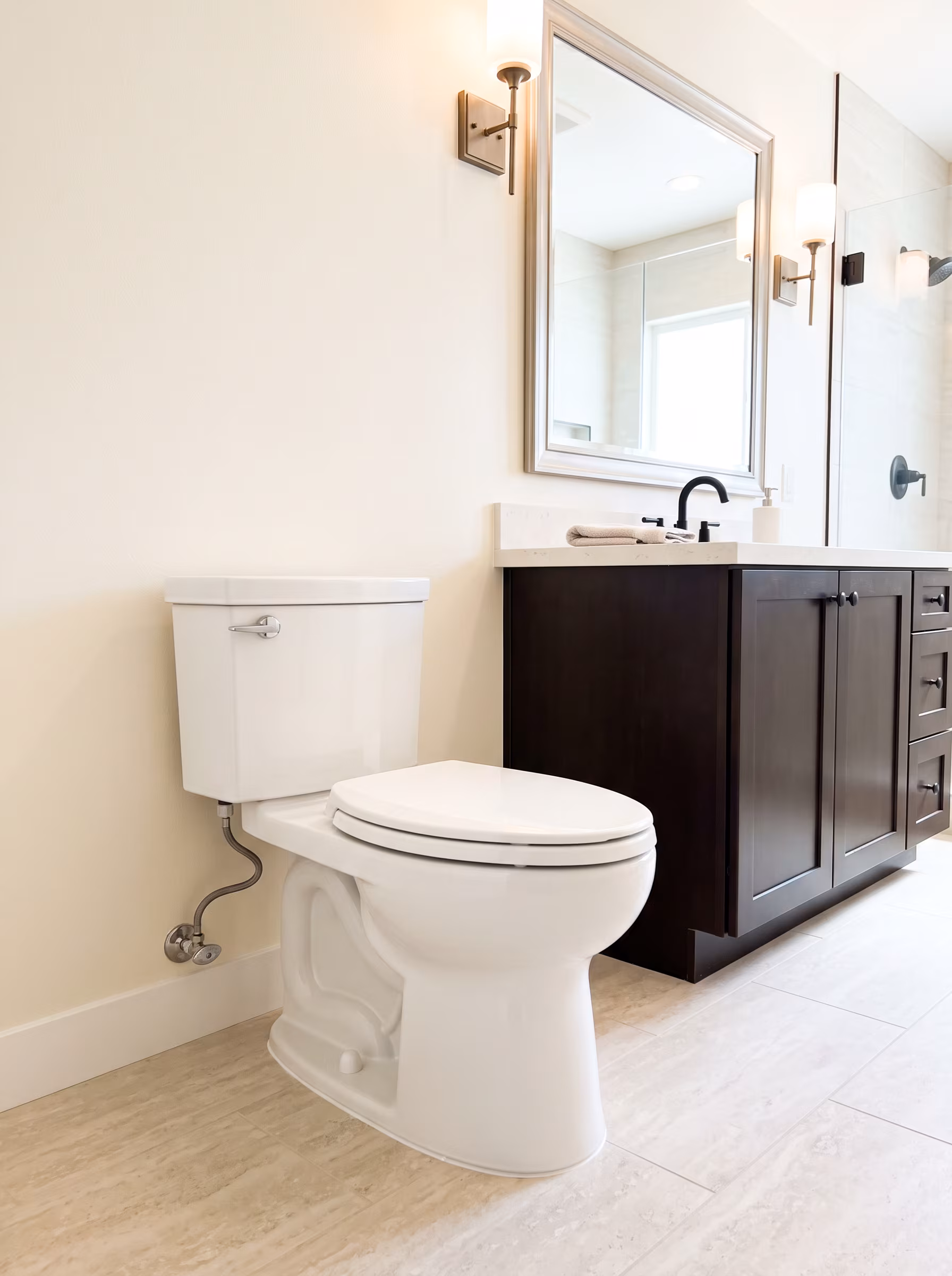 Finished modern bathroom with a newly installed wall-hung toilet